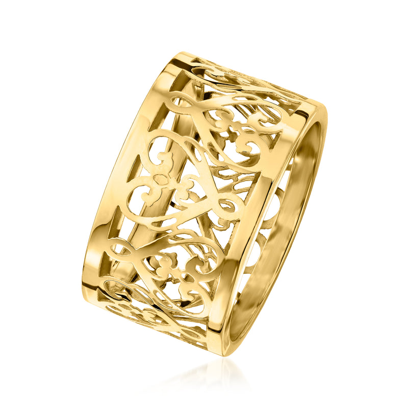 Yellow gold filigree heart ring, angled view showing openwork lattice and scrolls.
