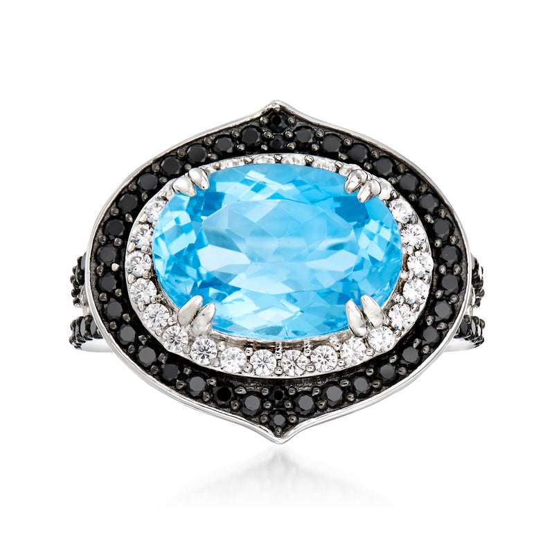 Sterling silver ring with oval Swiss blue topaz center, black spinel halo, white zircon accents