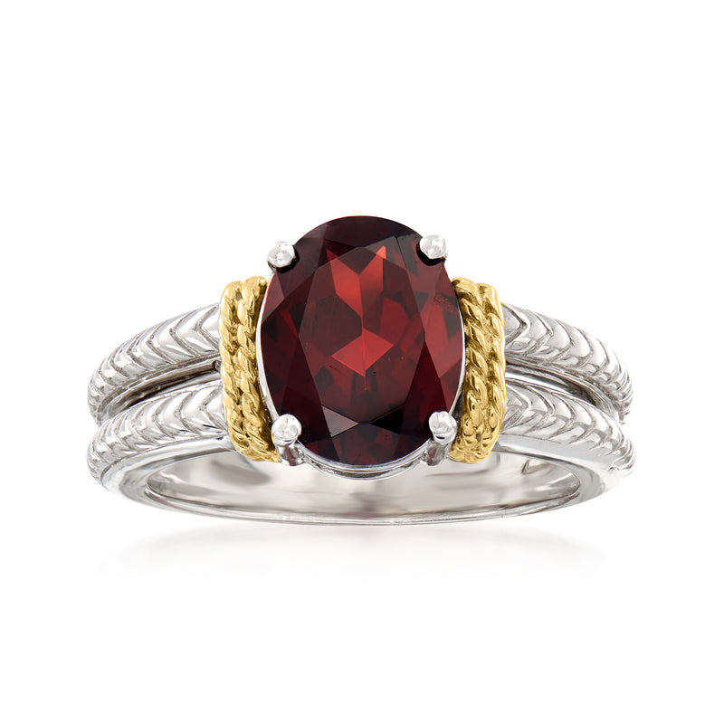 Garnet gemstone ring with oval red center, sterling silver band and 14kt yellow gold accents