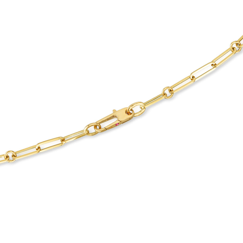 Yellow gold paper clip link necklace with clasp and small colored gemstone detail
