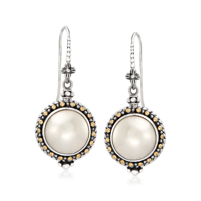 Sterling silver drop earrings with round white mabe pearl and beaded black and gold halo