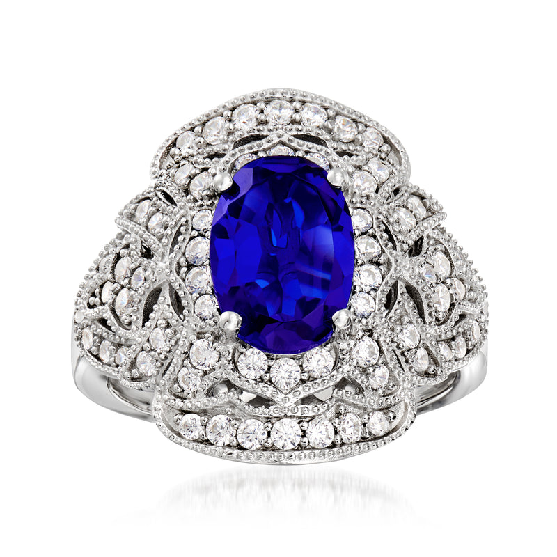 Sterling silver ring with oval blue simulated sapphire and clear CZ halo