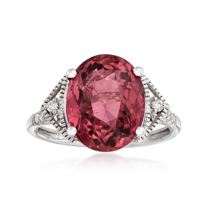 Pink tourmaline oval center stone ring in 14kt white gold with diamond halo
