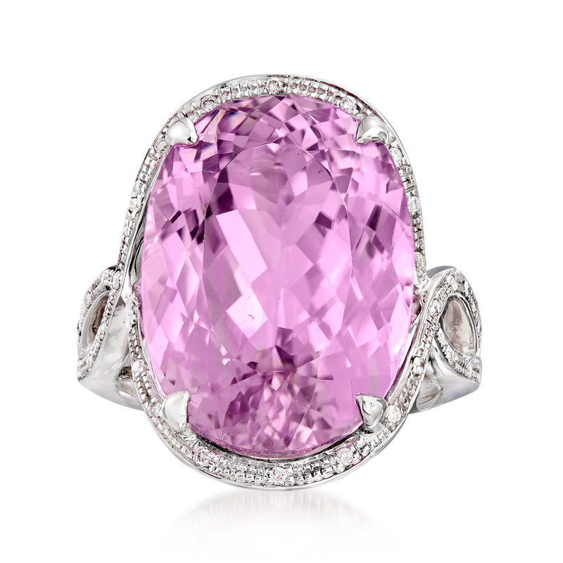 Oval pink kunzite halo ring in 14kt white gold with diamond border