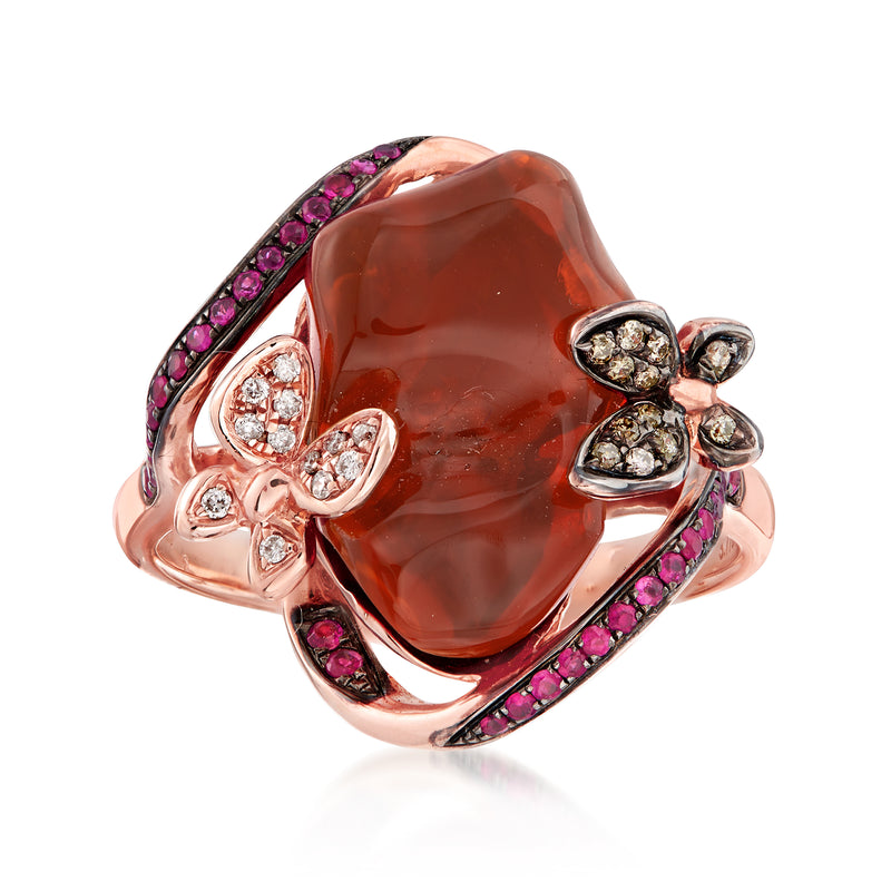 Rose gold ring with large orange opal center, pink gemstone halo, diamond accent flowers