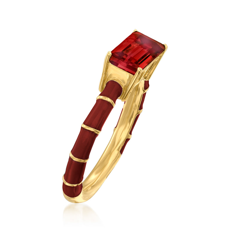 Gold ring with rectangular red gemstone and red enamel stripe accents, side view