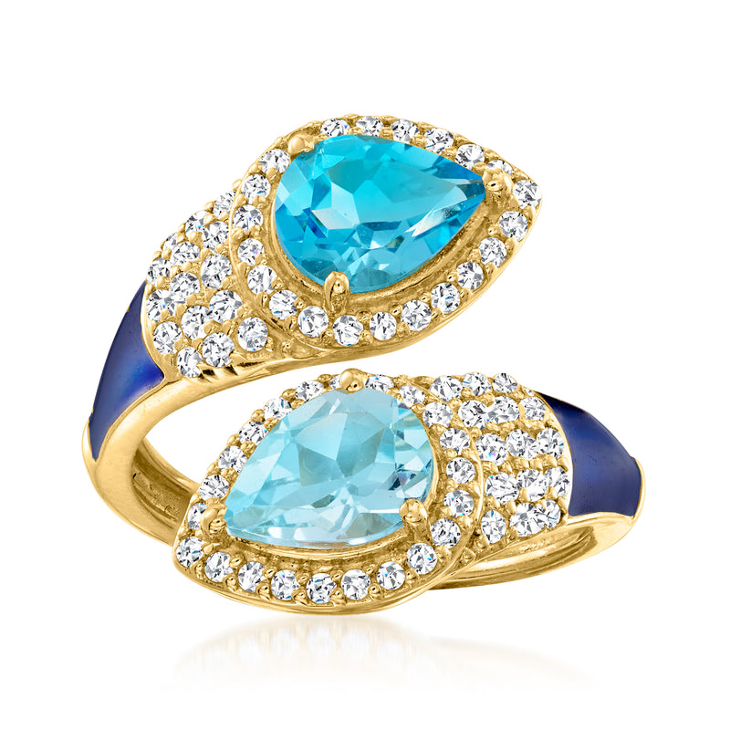 Bypass ring in gold over sterling with oval blue topaz, white stones, blue enamel.