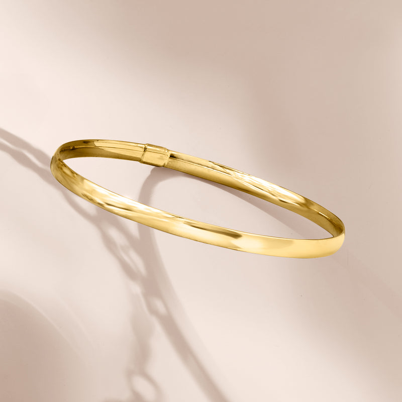 Yellow gold bangle bracelet angled view with hinged clasp detail