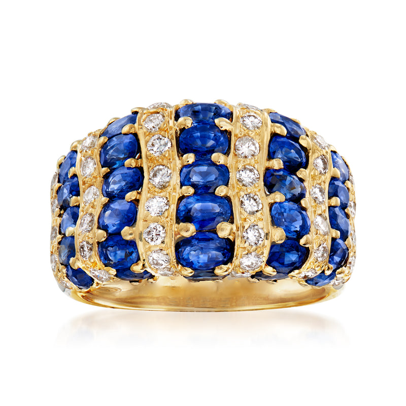 18kt yellow gold ring with oval blue sapphires and diamond lattice settings