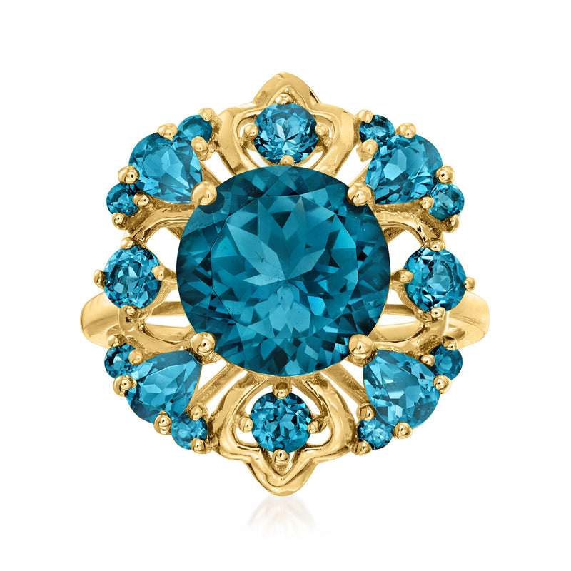 14kt yellow gold London blue topaz ring with oval center and round blue halo