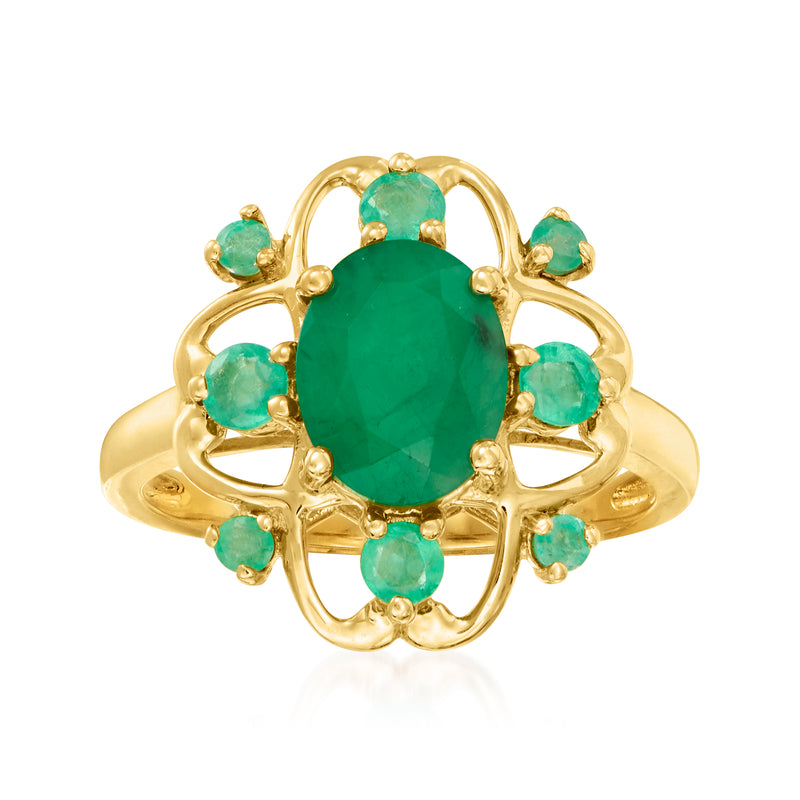 14kt yellow gold emerald ring with oval green center stone and 6 small green gems