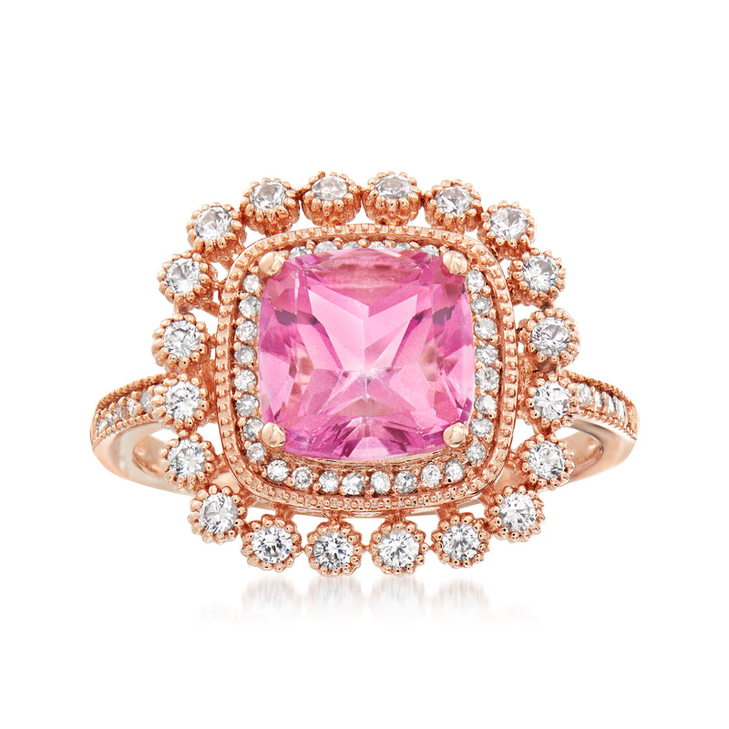 14kt rose gold ring with cushion-cut pink topaz center and diamond halo