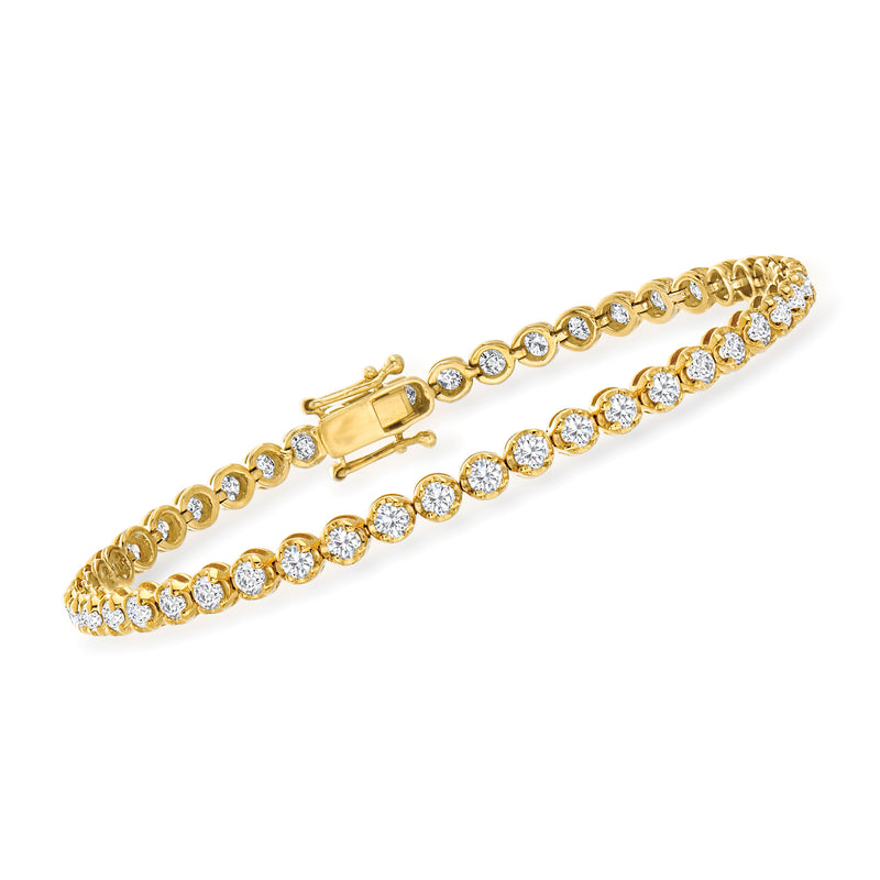 Gold tennis bracelet with round clear stones, prong-set rows, and box clasp