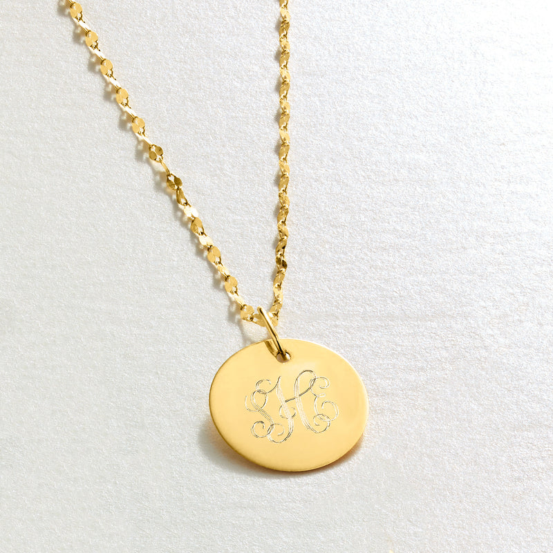 Yellow gold round monogram disc pendant on fine link chain