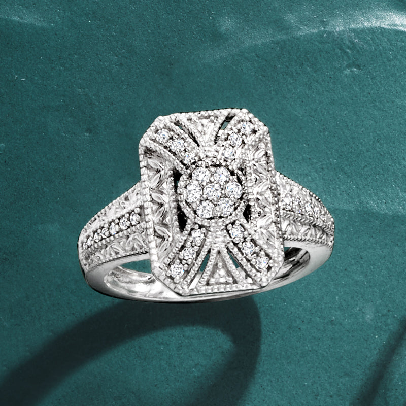 Sterling silver round-center diamond scrollwork ring with ribbon-like band