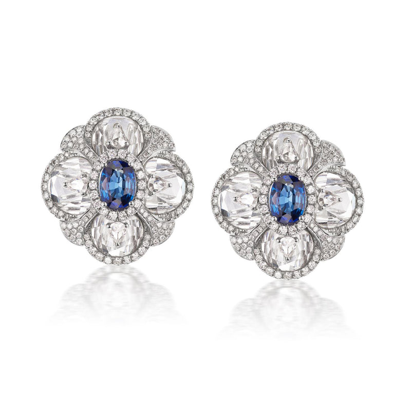 18kt white gold flower clip-on earrings with blue oval sapphire and diamond-like stones