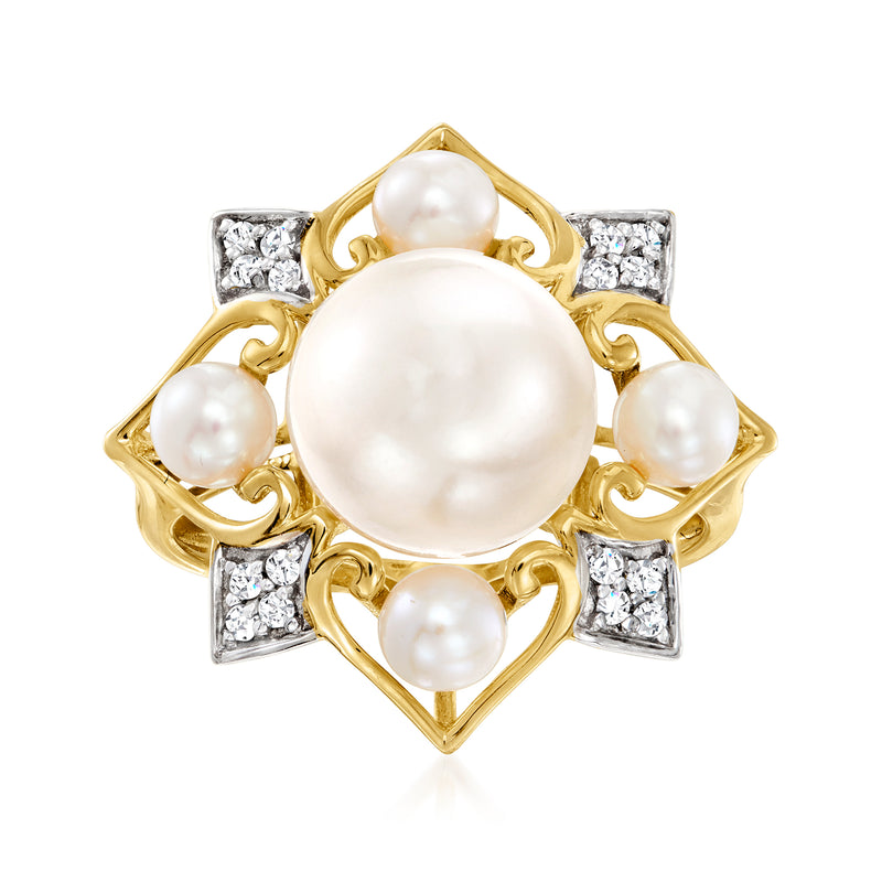14kt yellow gold ring with large cultured pearl, four small pearls, diamond side stones