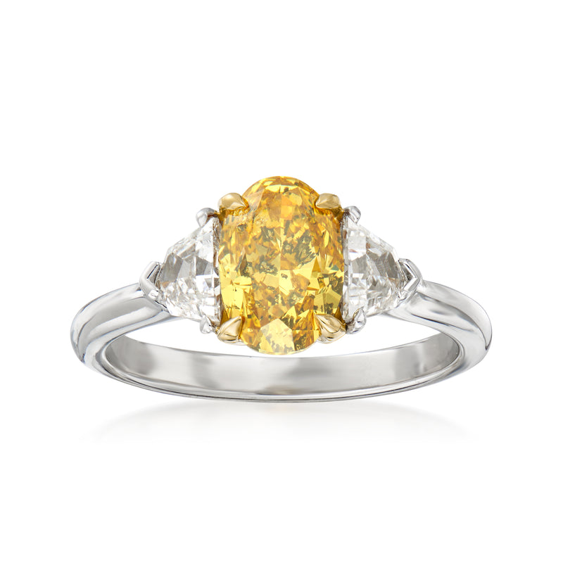 Platinum and 18k yellow gold engagement ring with oval yellow diamond and side white diamonds