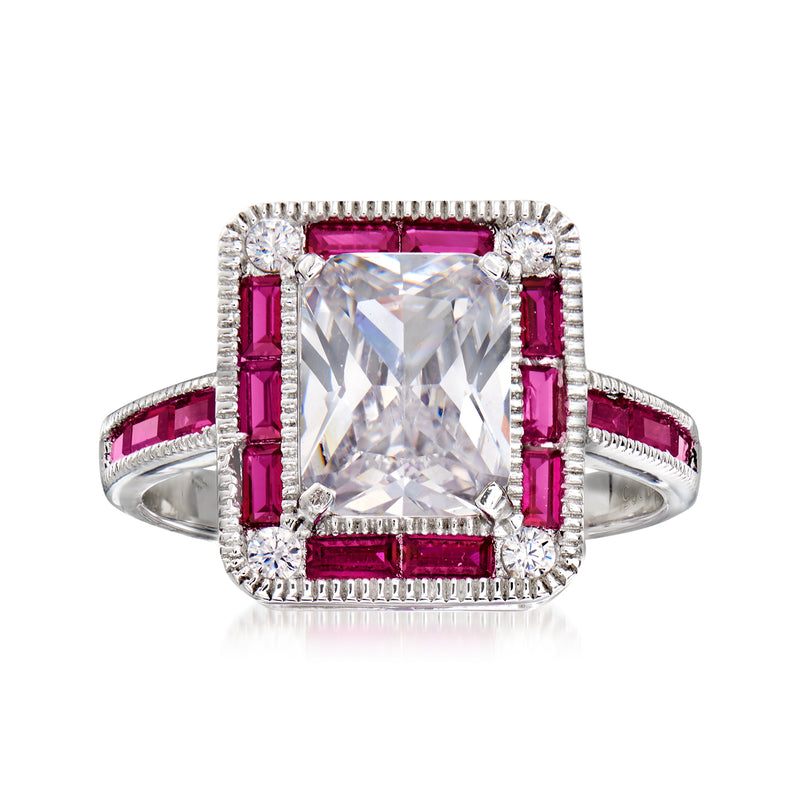Sterling silver ring with large clear CZ-style center stone and red simulated ruby accents