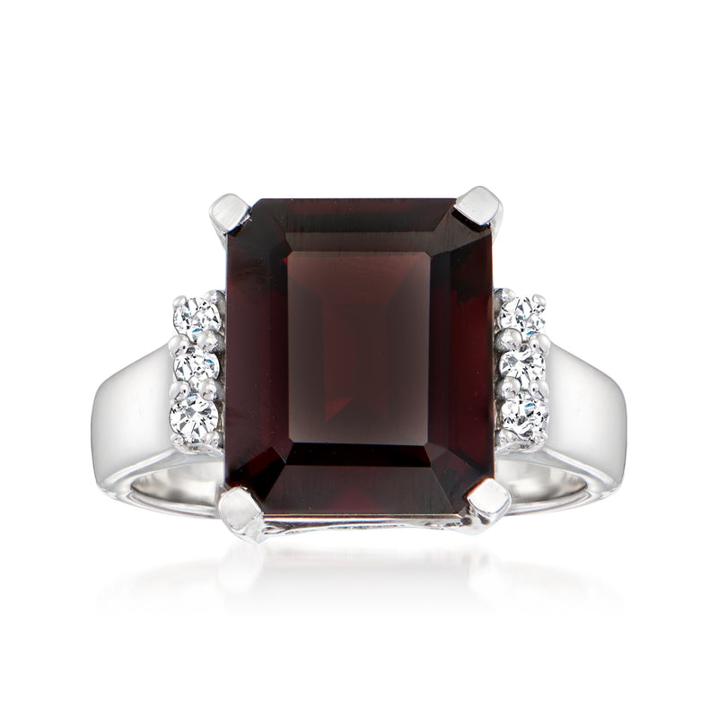 Sterling silver ring with square cushion garnet center and diamond cluster sides