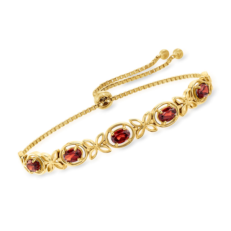 Garnet bolo bracelet in gold, with four red oval stations and adjustable cord ends