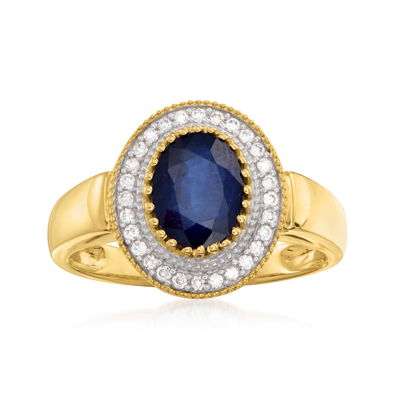 14kt yellow gold ring with dark blue oval sapphire and diamond halo