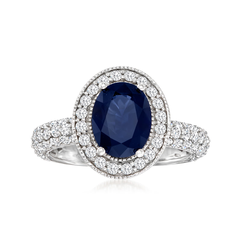 Oval sapphire halo ring in white gold with diamond band