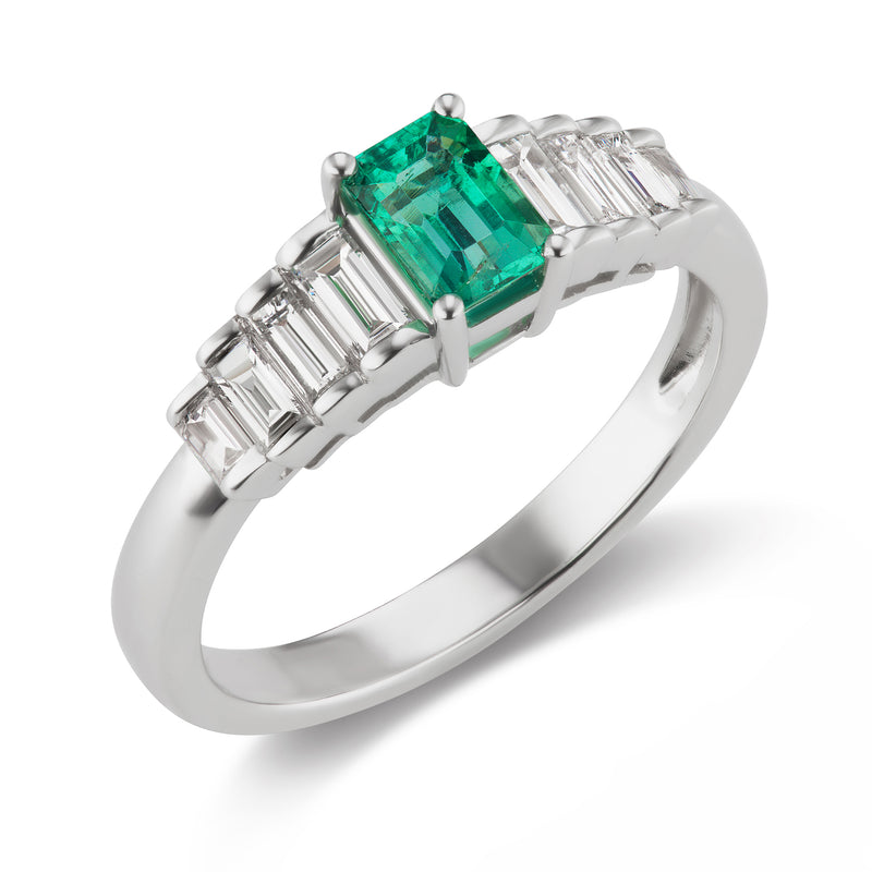 18kt white gold ring with emerald-cut green gemstone and baguette diamonds