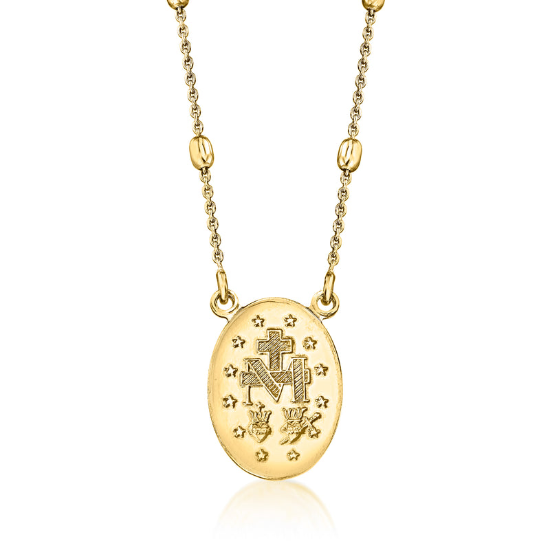 Gold-tone oval medallion with cross and letter M motifs on bead station chain