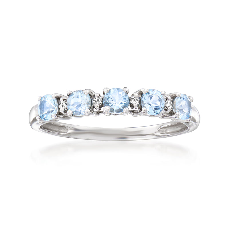14kt white gold ring with light blue aquamarine stones and small diamonds, rounded band