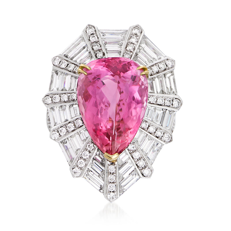 Two-tone gold cocktail ring with pear-cut pink topaz center and diamond halo settings