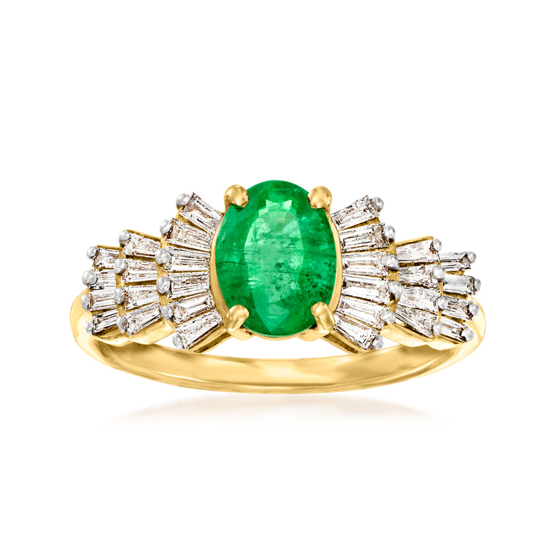 14kt yellow gold ring with oval emerald center and baguette diamond side stones