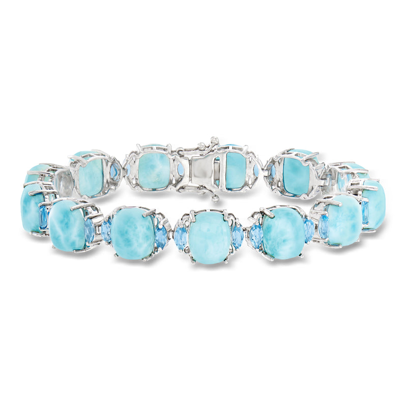Sterling silver bracelet with light blue oval gemstones in a row