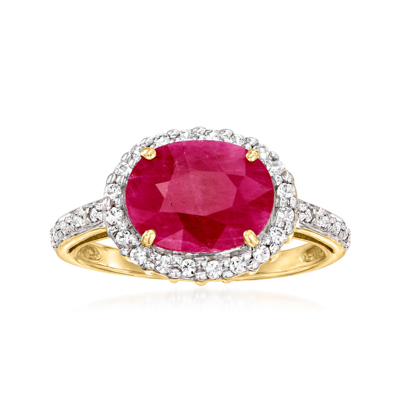 14kt gold halo ring with oval red ruby center and white topaz accents