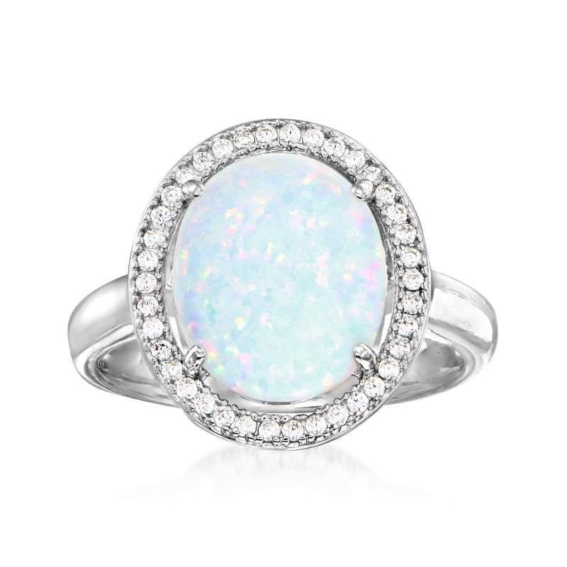 Sterling silver ring with oval opal-look stone and round CZ halo