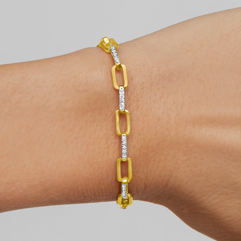 Diamond paper clip link bracelet in gold over sterling, worn on wrist