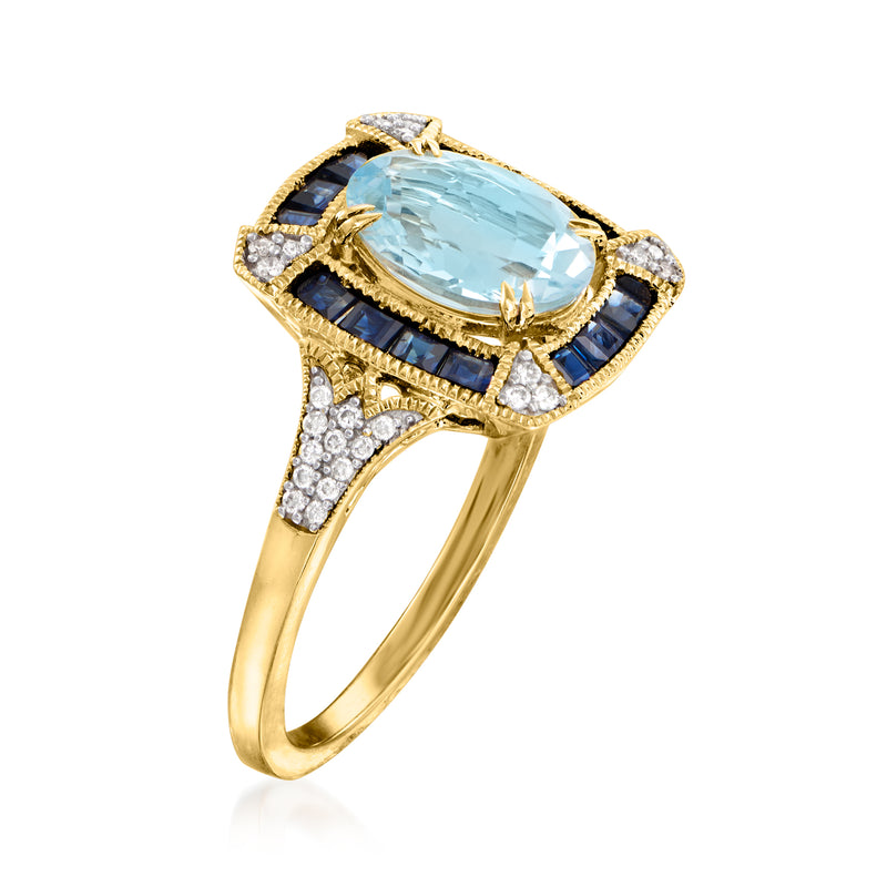 14kt yellow gold ring with oval aquamarine, blue sapphire baguette frame, diamond accents