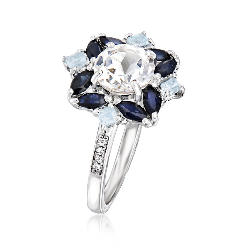Sterling silver ring with large oval white center, navy and light blue gemstone cluster