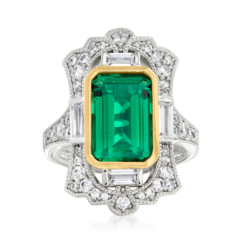 Sterling silver ring with green simulated emerald center, CZ halo, gold-plated bezel.