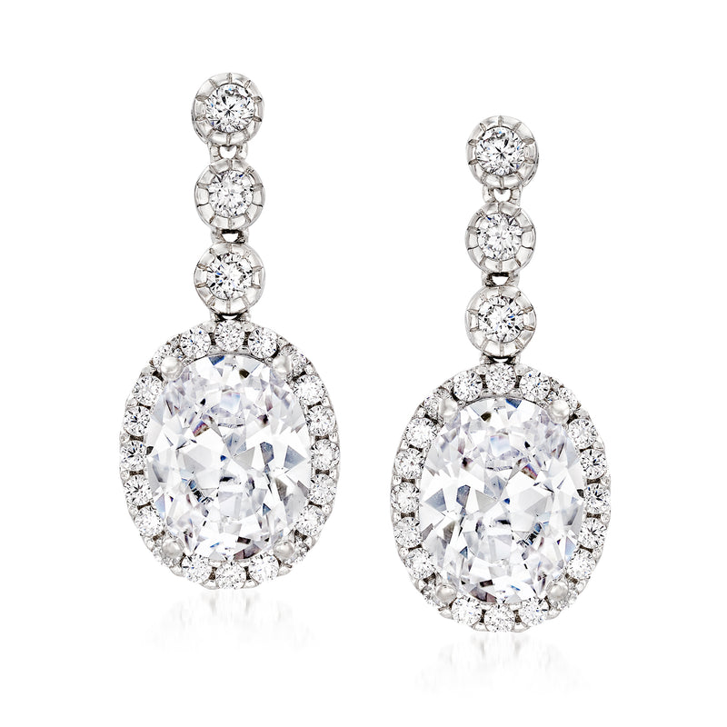 Sterling silver CZ drop earrings with three round stones and a pear-shaped crystal drop