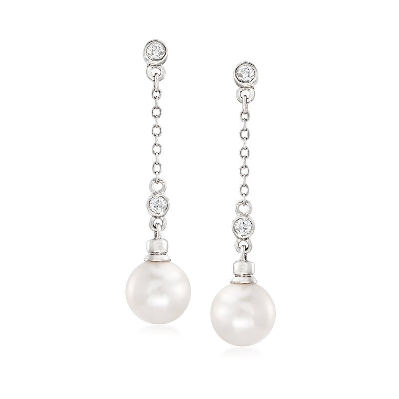 Drop earrings with white Akoya pearl and small diamond accents in 14k white gold.
