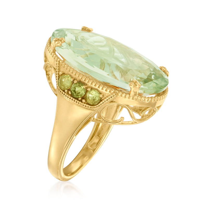 Gold ring with pale green oval gemstone and side green accents on open band