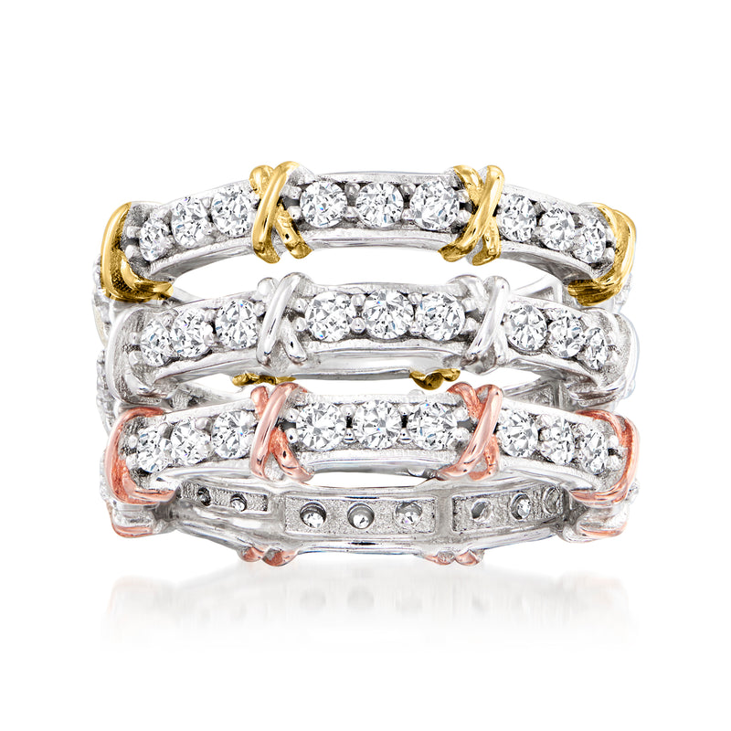 Three sterling silver eternity bands with round CZ stones and gold-tone accents