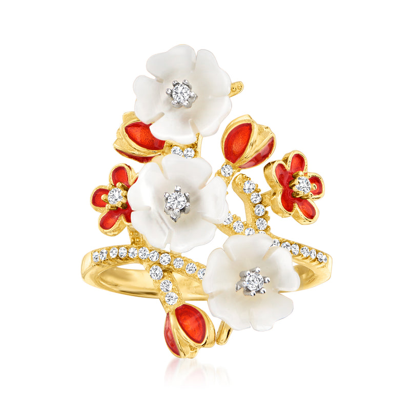 Gold-tone ring with white flower petals, red enamel accents, and sparkling crystal centers