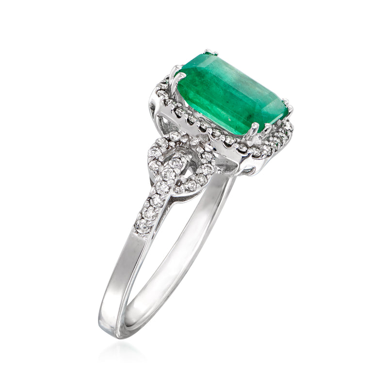 Emerald and diamond ring in white gold with emerald-cut green center stone