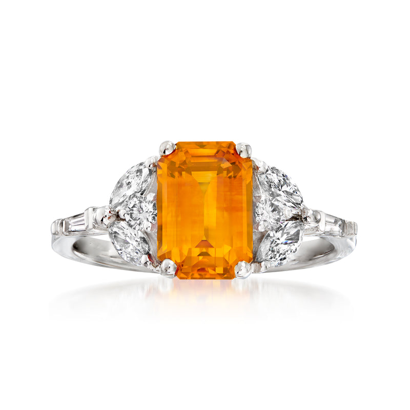Two-tone gold ring with emerald-cut orange sapphire and round diamond side stones