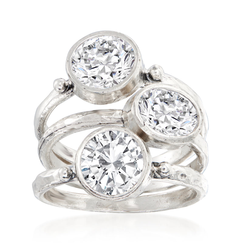 Three-stone CZ ring set in sterling silver with three round clear stones, shared band