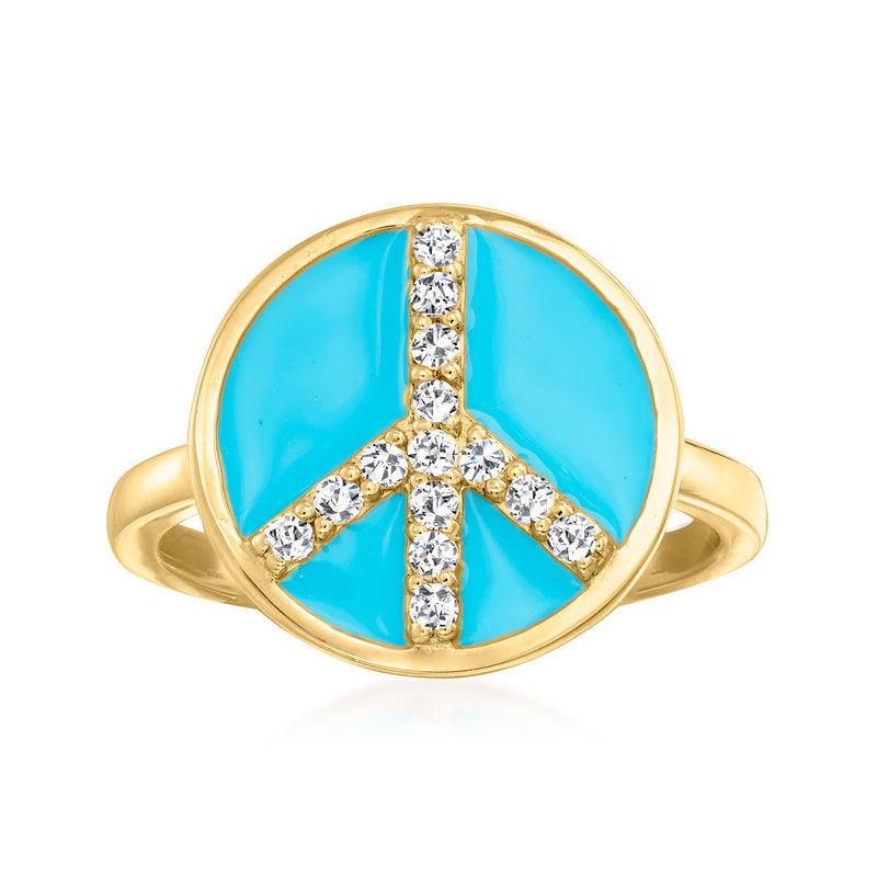 Gold peace sign ring with blue enamel and sparkling white stones, oval setting