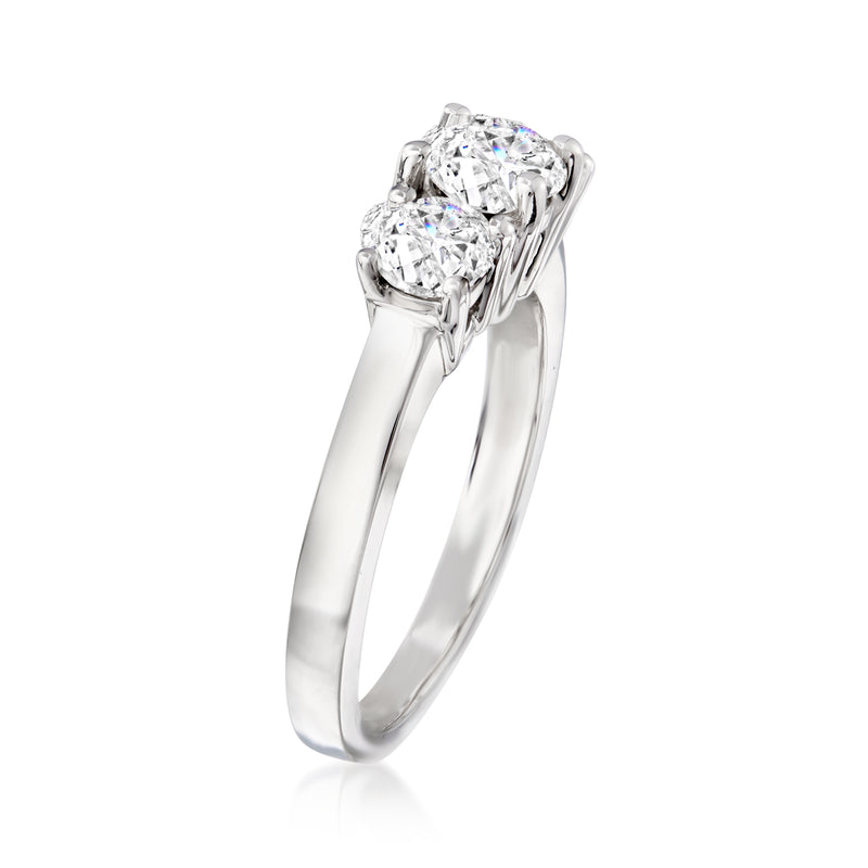 Three-stone diamond ring side view in 14kt white gold with round center stone