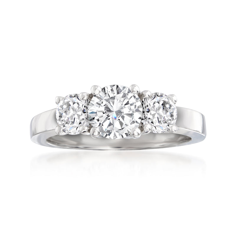 14kt white gold three-stone diamond ring, round center with two side stones